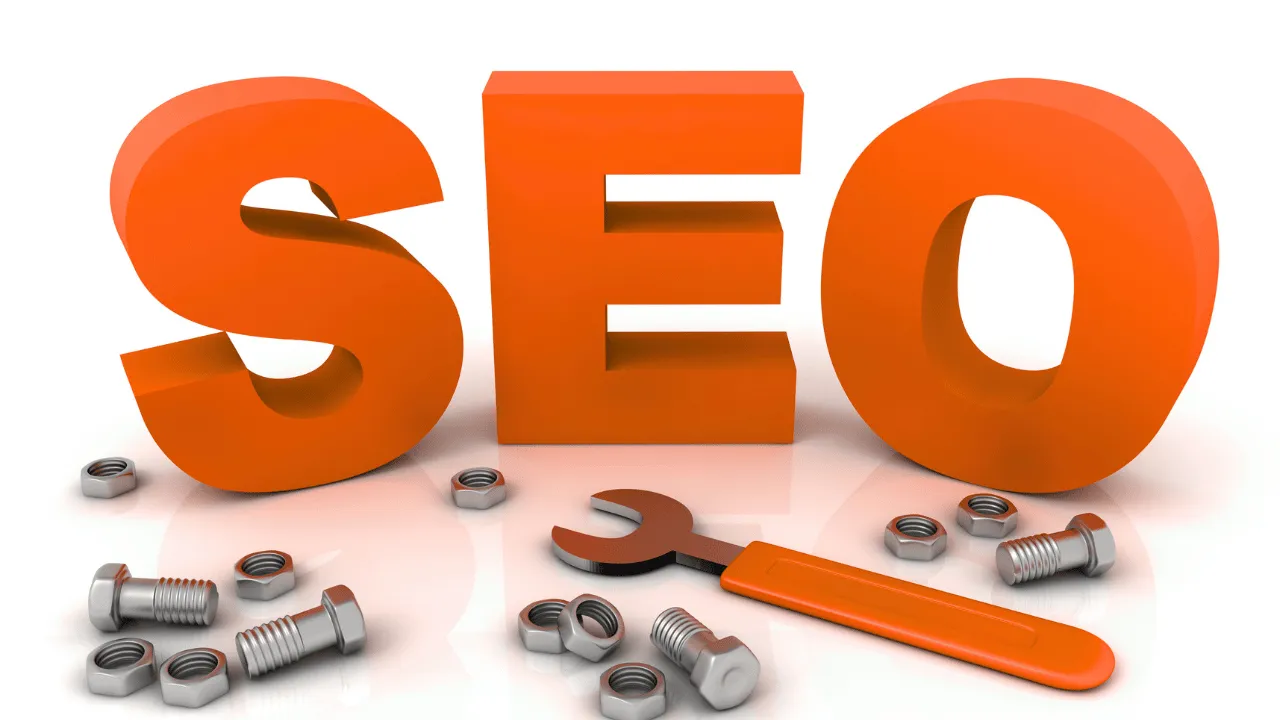 Orange letters spelling 'SEO' with a wrench and nuts on a reflective surface.